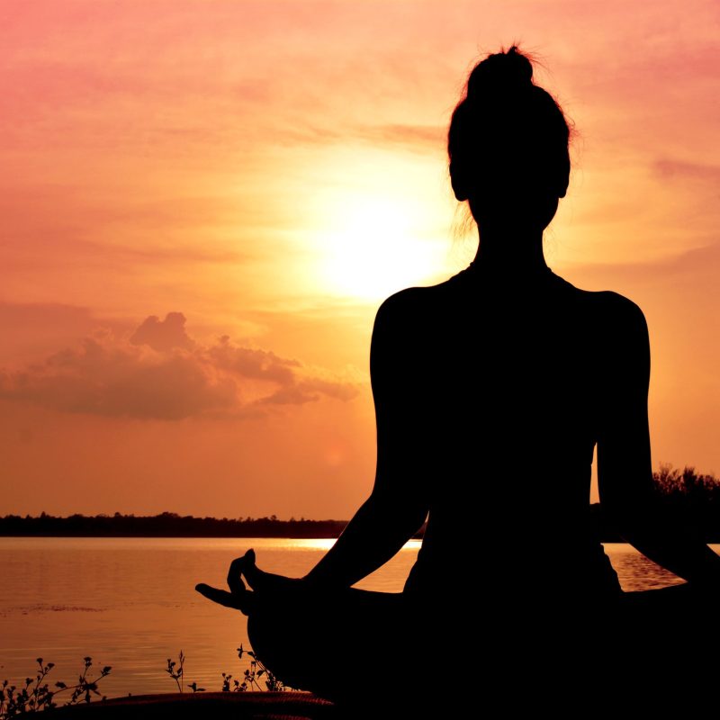 Silhouette women yoga in nature ,color of vintage tone Silhouette women yoga in nature ,color of vintage tone